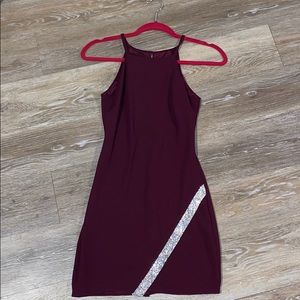 Maroon dress with a diamond stripe.